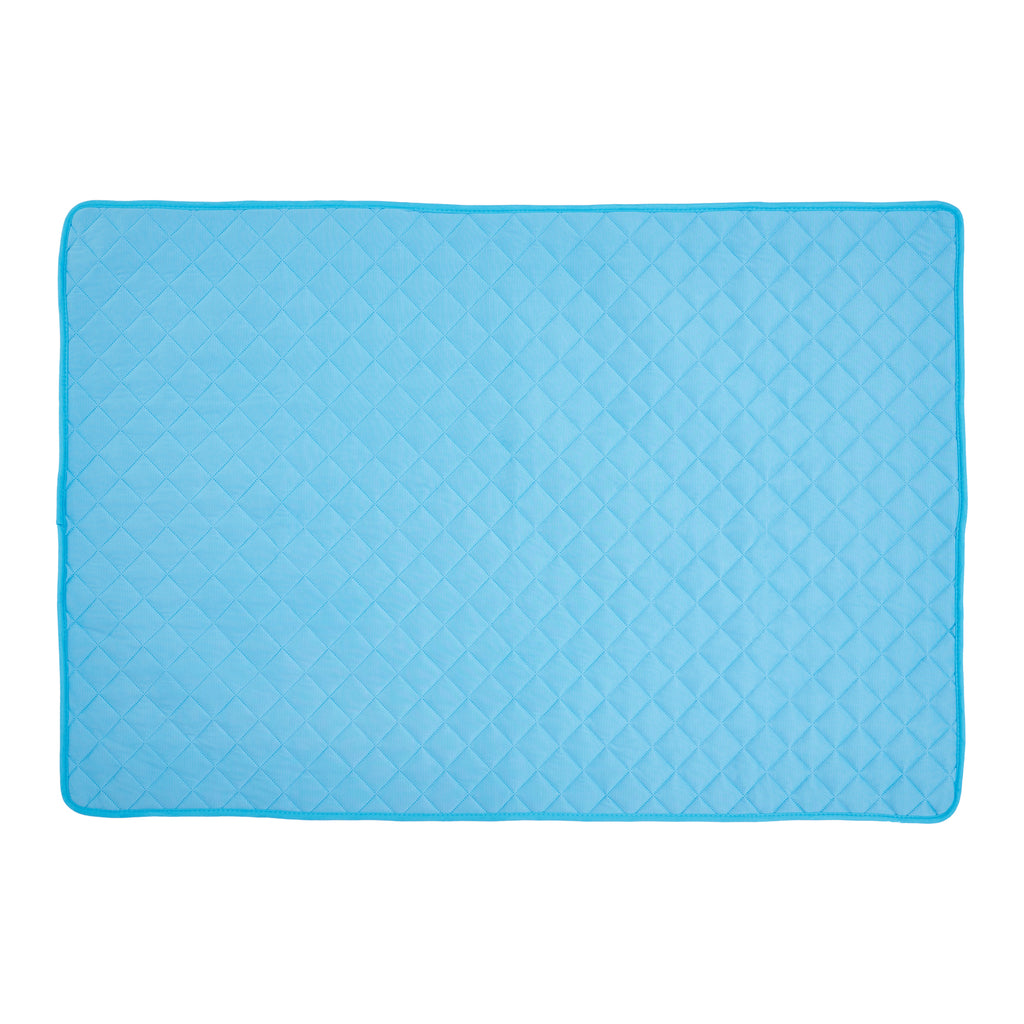 Dog lying on self-cooling mat — pressure-activated relief on warm day