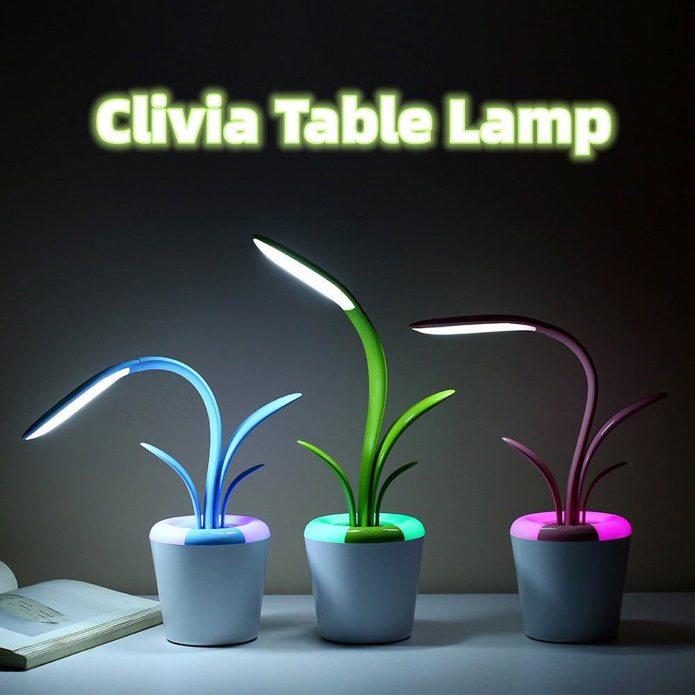 LED desk lamp in pink showing plant-shaped silhouette on desk