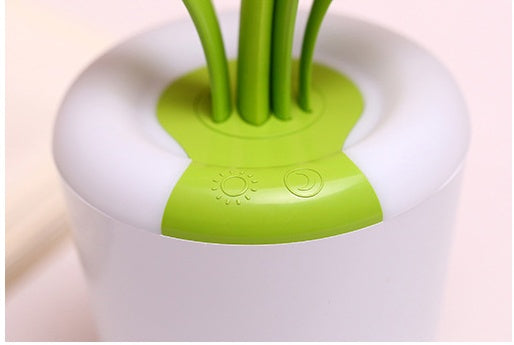 LED lamp in office setting providing task lighting on desk
